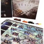 نمای کلی ستاپ و چیدمان بازی Brass Birmingham روی میز به همراه جعبه